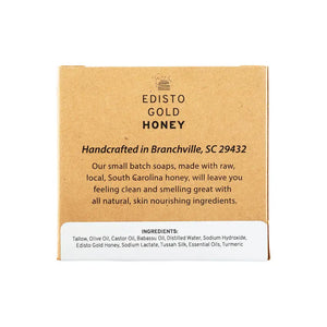A square kraft paper box of Edisto Gold Honey handcrafted soaps, featuring black text and a white ingredient panel at the bottom, set against a plain white background.