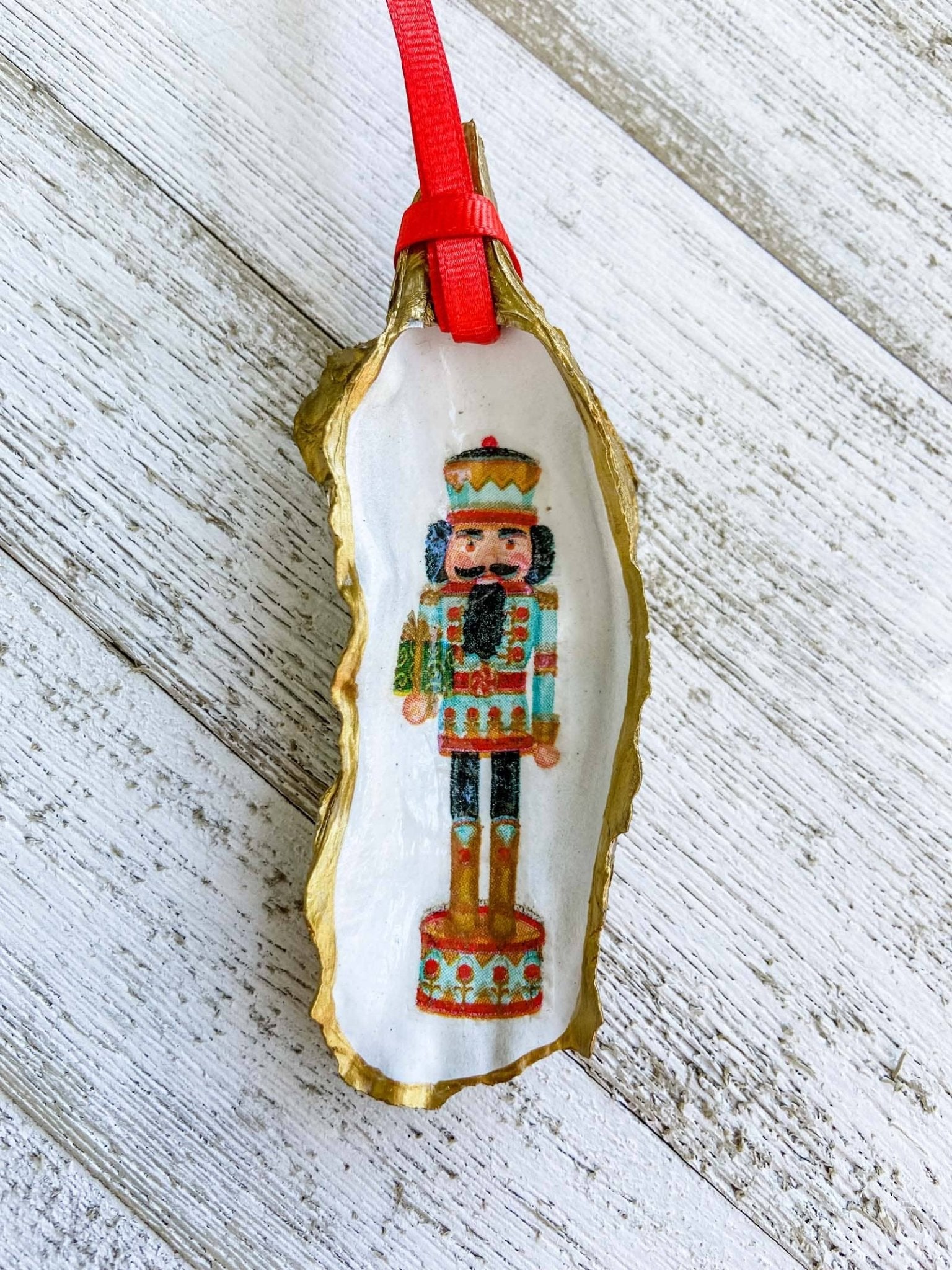 Nutcracker Oyster Shell Ornament: Blue with Present - Essentially Charleston